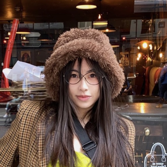 brown coat, brown hat and brown hair 